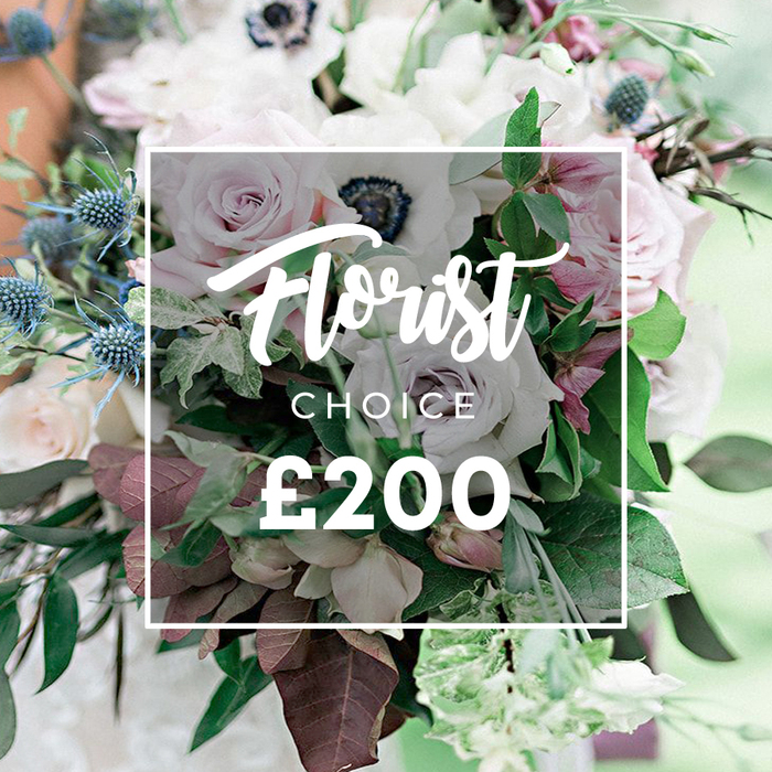 Portrayed in a high-resolution close-up, this premium Florist Choice bouquet radiates contemporary elegance with a nod to nature. The pastel-and-muted palette is as soothing as a quiet Sunday in Golders Green, with light pink garden roses opening softly, white anemones with near-black centers like midnight anchors, and delicate purple-grey roses adding a chic edge. The blue eryngium thistles introduce a spark of cool texture, their pointed tips contrasting with the smooth curves of petals. The bouquet is densely textured by a chorus of greens-eucalyptus-like sprays and burgundy-tinged leaves-that give the arrangement depth as if it were gathered from a private garden path. The composition appears natural yet intentionally curated, a style that speaks to modern weddings and refined home décor. Centered in the image, a semi-opaque white square frames the bouquet, bearing the words Florist Choice and the bold price ?200. The lighting is soft and diffuse, enhancing the delicate sheen on petals and the delicate veins in the leaves. This is a design that whispers luxury without shouting, suitable as a premium gift or a statement piece for a Golders Green event, whether a ceremony at a local venue or an intimate celebration at home. Availability for same-day delivery across Golders Green and nearby streets makes this a trustworthy choice for last-minute plans that still deserve extraordinary florals. The gentle, cinematic background evokes a spring garden at dawn, letting the bouquet glow with a quiet, scented grace.