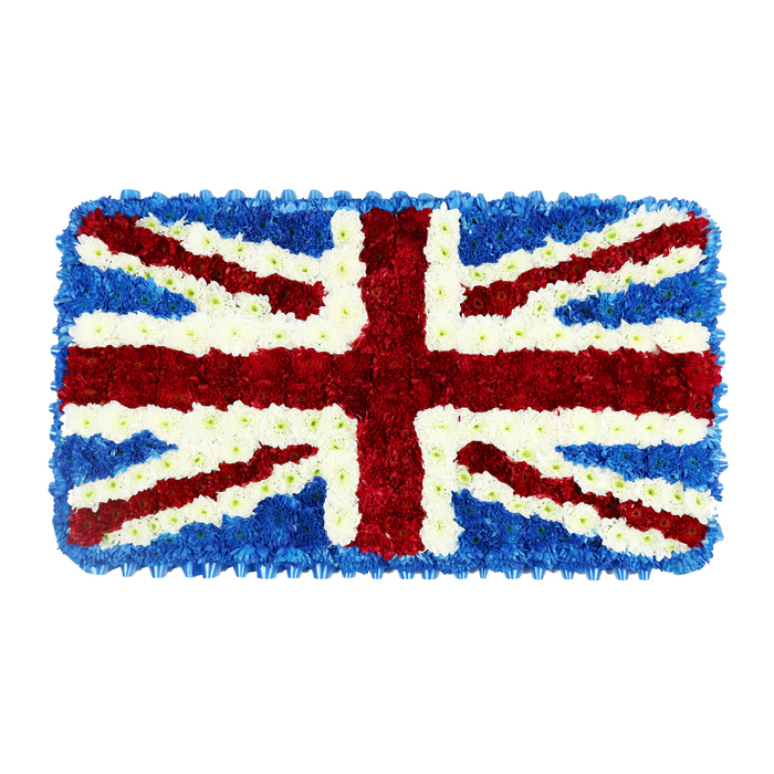 In this image, the Union Jack is transformed into an opulent floral tribute, its rectangular form made entirely of small, tightly packed flowers that create a luxurious, tapestry-like texture. Set against a clean white background, the design stands alone, every colour and line clearly visible, as if laid on an altar or easel at a dignified service in Golders Green. The deep blue sections, likely formed from clusters of compact hydrangeas or similar blossoms, provide a rich, almost inky backdrop that envelops the central design and forms a neat border around the whole piece. Across this sea of blue, the broad red cross of St George runs vertically and horizontally through the centre, its bold shape constructed from dense scarlet blooms whose rounded heads give the cross extra depth and prominence. Diagonal red bands representing St Patrick's Cross weave through this central motif, their narrower width lending a sense of intricacy and movement. Carefully placed white flowers surround each red line, creating the correct fimbriation and also establishing the broader diagonal white arms of St Andrew's Cross. These white areas are bright but soft, adding clarity without harshness, like the pale sky above Golders Hill Park on a cool remembrance morning. Each flower appears snugly nestled next to its neighbours, with no gaps, conveying a feeling of togetherness and shared respect. The overall mood is solemn yet proud, suited to a funeral, memorial service, or national commemoration, perhaps honouring a loved one with strong ties to the United Kingdom. Crafted with the steady, practised touch of a local Golders Green florist, this floral flag becomes both a symbol of national identity and a tender expression of farewell.