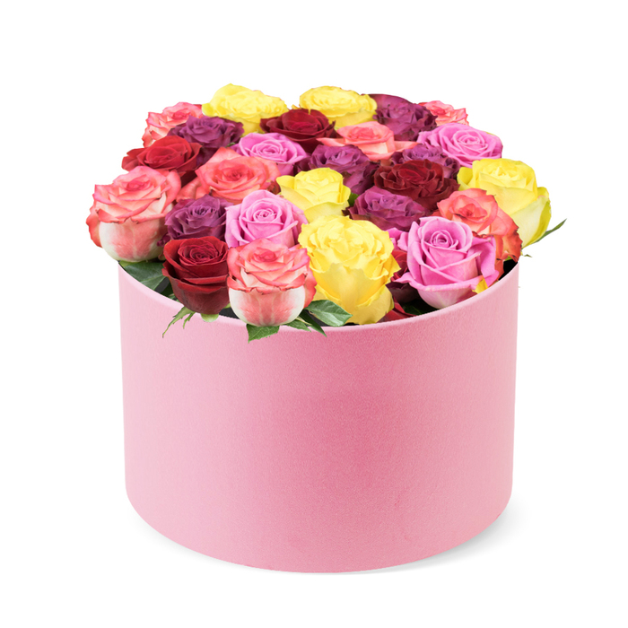 An elegant rose box of soft pink velvet arrives in a quiet studio light, the rounded box resting on a stark white backdrop. The cylindrical form and the slightly curved lid reveal a dense display of roses, approximately thirty to forty blooms forming a domed sculpture that overflows from the box. The fresh roses showcase a rich tapestry of colors: cheerful bright yellow, romantic deep red and burgundy, various shades of pink ranging from soft blush to vibrant fuchsia and multi-toned petals with hints of cream, and opulent purple-plum hues. Each rose appears perfectly bloomed, with healthy, tightly packed petals, indicating peak freshness and premium quality. A few vibrant green leaves are visible peeking between the full blossoms, adding a natural touch of freshness and contrast.
This elegant rose box embodies premium flower delivery and makes an ideal gift for Valentine's Day, anniversaries, birthdays, Mother's Day, or just to brighten someone's day. Its exquisite design and diverse color palette suggest themes of love, celebration, beauty, and sophisticated home decor, making it a perfect visual for articles on luxury gifts, floral trends, special occasion bouquets, or tips for choosing the perfect flower arrangement. The generous rounded form, with the velvet-like exterior, signals meticulous craftsmanship and a timeless, modern aesthetic near Golders Green.