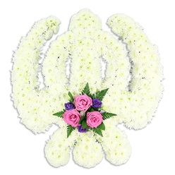 A striking Sikh Khanda floral tribute fills the frame against a spotless white background, its sacred outline rendered with remarkable precision through a carpet of small, snowy white blooms. Each petal of the tightly clustered chrysanthemums, or similar daisy-like flowers, contributes to a plush, cushioned surface that looks almost cloud-like yet firmly structured. The central double-edged sword stands upright and strong, enveloped by the round chakkar, while the two curved kirpans spread gracefully to either side, their lines clearly read even without any colour contrast. The craftsmanship hints at experienced hands, the kind you might find in a long-established Golders Green flower shop, carefully shaping each curve to reflect deep respect for Sikh tradition. At the very base, where the swords meet, lies a thoughtfully placed burst of colour: three soft pink roses in perfect bloom, their petals slightly cupped as if holding a quiet prayer. Around them, smaller deep purple blossoms add a note of solemn richness, while sprigs of fresh, deep green fern foliage and leaves give texture, movement, and a feeling of life continuing. The overall palette stays predominantly white and cream, with the pink and purple grouping acting like a gentle focal point, drawing the eye to the heart of the tribute. A subtle shadow beneath the arrangement suggests it is elevated on a stand, ready to be placed by the family at a Sikh funeral or remembrance service in and around Golders Green, Hendon, or Temple Fortune. The atmosphere is one of stillness, reverence, and heartfelt remembrance, expressing sympathy and honour in a quietly powerful way.