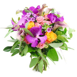 A rich, rounded bouquet brimming with premium blooms is set against a clean white backdrop, so every nuance of colour and form reads clearly. The most striking elements are the exotic purple Vanda orchids, their velvety petals wide and slightly cupped, marked with intricate speckles that create a lattice-like pattern reminiscent of fine fabric. Nestled around them are bold, upbeat orange roses, each bloom perfectly formed with layers of tightly coiled petals, lending the arrangement a vibrant, celebratory energy. Softer notes come from the pastel pink garden roses, some still in tight buds with smooth outer petals, others opening into fluffy, many-petalled rosettes that suggest gentle romance and warmth. Rising gracefully from within the bouquet, several calla lilies in a refined mauve and plum palette arc delicately upward, their smooth, trumpet-shaped flowers adding height and a modern, sculptural line. Abundant green foliage, including soft, silvery eucalyptus leaves and deeper forest-green accents, frames the blooms and gives the design a lush, garden-fresh feeling. Fine clusters of light lavender filler flowers and airy green sprigs are woven throughout, contributing subtle texture and a sense of movement, as if the bouquet has just been gathered from an elegant garden in early evening light. The visible, bound stems at the base reveal a hand-crafted, florist-made piece. This is the kind of luxurious bouquet that would feel at home on a dining table off Golders Green Road or as a special congratulations gift delivered to a home near Golders Hill Park, radiating sophistication, joy, and thoughtful attention to detail.