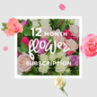 A richly detailed rose bouquet fills this image, designed to evoke the experience of receiving fresh flowers month after month in Golders Green. The composition is dominated by tightly clustered roses in soft, romantic tones: blush pinks, creamy whites, hints of lilac, and vibrant pops of fuchsia and berry. Each bloom is captured at a slightly different angle, so you can almost trace the spiral of petals as they curve outward, some just beginning to unfurl, others fully open in generous rosettes. Between the blooms, glossy green leaves create pockets of shadow and depth, making the colours feel even more luminous, like the play of light on foliage you might notice walking through Golders Hill Park on a clear afternoon. The background is smooth and light, allowing the flowers to stand out, while a scattering of rose petals and small blossoms encircles the main bouquet, as if a previous arrangement has left a trail of beauty behind. This gives the sense of movement and continuity, mirroring the rhythm of a 12-month subscription-each delivery renewing the room with fragrance and fresh texture. You can imagine the soft, velvety feel under your fingertips, the gentle rustle of leaves, and the subtle perfume drifting through a hallway or living room after the florist has just visited. The overall mood is one of quiet celebration and lasting thoughtfulness, suitable for any occasion when someone in NW11 wants to keep their space filled with welcoming, rose-scented warmth all year long.