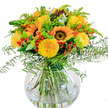 A jubilant arrangement featuring sunny yellow sunflowers and plush garden roses rests elegantly in a clear, round glass vase, capturing the positive spirit and diversity of Golders Green. The sunflowers' golden petals seem to radiate warmth-echoes of midday strolls in nearby Golders Hill Park-while the roses, with their creamy, romantic spirals, invite closer admiration. Garnet-rich hypericum berries are scattered between, their glossy forms lending playful contrast and a hint of festivity suited for any local gathering. The greens-cascading ferns, wispy goldenrod, and silvery eucalyptus-soften the bold palette and add a gentle sense of movement, as if touched by a soft breeze running down Finchley Road. Visible in the transparent, bowl-shaped vase, leafy stems cross in a tangle of garden-fresh abundance, enhancing the bouquet's clean, contemporary presentation. Close your eyes and imagine the subtle perfume of roses mingling with hints of eucalyptus-a refreshing trace carried into the home after a morning at the Golders Green farmers' market. Crafted with care by a neighbourhood florist, this arrangement is perfect for birthday celebrations, family lunches, or simply brightening a neighbour's day. Its joyful energy, lively texture, and harmonious blend of seasonal flowers celebrate both the changing seasons and the welcoming, colourful community of Golders Green.