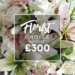 An intimate close-up reveals a meticulously curated Florist Choice Bouquet, with white roses and white lilies shining against generous greenery. The inner petals show a hint of pink, and subtle pink accents breathe among the blossoms, while eucalyptus leaves frame the composition, adding depth and freshness. The frame is filled with blooms of generous size and velvet texture, each petal catching the light to reveal premium quality. A central overlay-white and minimal-displays the same product identity: Florist in a cursive script, CHOICE BOUQUET in uppercase sans, and the bold ?300 price set in high-contrast white. The bouquet feels designed for heartfelt moments-birthdays, anniversaries, sympathy-resonating with the spirit of Golders Green and the nearby streets, where families value thoughtful, enduring gifts. A same-day delivery option serves local homes and offices across Golders Green, Temple Fortune, and Cricklewood, ensuring this luxurious arrangement reaches the recipient with care and attention. The image evokes calm opulence: white tones with a whisper of pink, a touch of greenery, and the craft of a florist who understands how flowers can speak when words fall short.