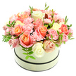Soft as a summer sunrise, this lush floral composition sits in a round cream hatbox with two thin, dark bands - one at the rim and one at the base - set against a clean white backdrop. The arrangement is a domed, densely packed cluster of large velvety roses and ruffled baby-pink carnations, graduating from warm coral-peach and apricot at the hearts of the roses to delicate blush pink and creamy ivory on the outer petals. The carnations weave through the roses like whispers of texture, their frilled edges adding a gentle, tactile contrast to the rounded rose blooms. Scattered sparingly are sprigs of fresh green foliage with small, elongated leaves that give the composition a subtle lift and a bright, natural accent. Soft, natural light appears to skim across the petals, highlighting their velvety sheen and casting faint, flattering shadows that emphasize the bouquet's plush, domed silhouette. The scent suggested by the composition is light and powdery - a comforting, new-morning sweetness that invites you to linger and breathe. This is an elegant, romantic gift that feels both timeless and modern, suitable for birthdays, anniversaries, Mother's Day, Valentine's gestures, or as a heartfelt congratulations. As a local touch, the palette and quiet refinement of the arrangement recall mornings wandering Golders Hill Park or picking up fresh produce on Golders Green Road - a small, considered luxury for someone close by. The craftsmanship is evident in the tight, intentional placement of each bloom, a careful design that balances abundance with restraint and lifts ordinary moments into something gently celebratory.