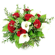 A rounded, luxurious bouquet of deep red roses and pristine white calla lilies fills the frame against a stark white background, photographed from a gently raised, eye-level view that lets every bloom take centre stage. Clustered at the core, full red rose blossoms unfurl in tight, layered spirals, their velvety petals creating pockets of shadow and light that suggest depth, warmth, and intense emotion. Nestled among and rising above them, white calla lilies offer a striking contrast, each one a smooth, sculpted funnel of ivory that arches gracefully and reveals a slender, creamy yellow spadix inside. The lilies' clean, architectural lines give the arrangement a contemporary edge while maintaining a timeless sense of purity and grace. Between the flowers, plentiful greenery introduces both softness and structure: delicate eucalyptus stems with small, rounded, silvery-green leaves create a feathery halo around the bouquet, while broader, richer green leaves peek through to add body and a garden-fresh feel. All the stems are gathered into a clear glass vase, its ribbed base just visible at the bottom of the image, mostly hidden by the dense foliage and blooms above. The lighting is bright and even, accentuating each tone of red, white, and green, as though the bouquet has just been styled by a local florist in Golders Green for delivery along Hoop Lane or to a cosy flat near Childs Hill. The overall impression is of a romantic, generously proportioned floral display, perfect for anniversaries, Valentine's Day surprises, or an elegant centrepiece at a small wedding celebration in NW11.