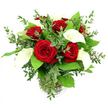 A dramatic yet refined bouquet of red roses and white calla lilies is captured here in bright, even light, set against a crisp white background that strips away distraction and focuses attention on the floristry. At the centre, around half a dozen crimson roses bloom fully, their velvety petals spiralling outward to create a rich, layered texture that feels both classic and indulgent. Standing between them, several pure white calla lilies rise with quiet poise, their sleek, trumpet-shaped blooms curving in elegant arcs and encircling a slender golden-yellow spadix, lending the arrangement a sculptural, almost modernist quality. Around this core of red and white, lush greenery creates a sense of fullness and life: eucalyptus sprigs with soft, round, silvery-green leaves introduce gentle movement and a touch of wildness, while broader, darker foliage provides a deep, emeraldf backdrop that frames the main flowers with strong contrast. All stems are gathered neatly inside a clear cylindrical glass vase, whose subtle ribbed base adds a hint of texture; the visible green stems and clear water reinforce the impression of freshness, as though the bouquet has just been prepared for same-day delivery around Golders Green and nearby roads off Golders Green Road. The lighting is bright yet soft, picking up fine details like the smooth, waxy surface of the calla petals and the almost velvet-like quality of the rose blooms. The mood is romantic and composed, perfect for marking an anniversary, Valentine's surprise, or heartfelt declaration at home in the Golders Green area.