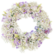 A delicate funeral wreath takes centre stage against a bright, uncluttered white background, the entire composition focused on a single, unbroken circle of fresh flowers. The wreath is densely encircled with Baby's Breath, their tiny white blossoms massed together so thickly that they create a soft, cloud-like halo, full of airiness despite the abundance of stems. Rising from this mist are ruffled Lisianthus flowers, carefully spaced to give a rhythmic pattern around the ring. Each Lisianthus bloom displays pure white inner petals, while the outer edges are finely tipped in purple, shifting from gentle lavender to a slightly deeper violet, adding subtle contrast without ever feeling harsh. Some flowers are wide open, their layered petals creating delicate shadows and a sense of depth, while smaller buds and half-open forms, tinted with pale green and creamy yellow near the base, hint at ongoing life and quiet renewal. The centre of the wreath remains empty and perfectly round, a clear opening that symbolises continuity and the circle of life-ideas that resonate deeply at times of loss. Because the background is stark white and free from any objects or text, every floral detail stands out: the fluffiness of the Gypsophila, the silky curves of Lisianthus petals, and the careful craftsmanship behind the design. This tranquil white-and-purple tribute could easily be imagined resting on a stand during a funeral in Golders Green, perhaps after being delivered from a local shop just off Finchley Road, bringing a note of calm, respectful beauty to a chapel or family gathering where words feel difficult to find.