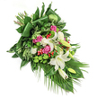 This lavish sympathy spray, flowing diagonally across a crisp white background, was created with genuine care by an expert florist serving Golders Green. At its center, luminous white lilies open with poised grace, some fully revealing soft yellow stamens while others remain in the promise of their bud. They're surrounded by gentle blushes of deep pink and fuchsia roses, each bloom folded with utmost care, and highlighted by bright green, spherical santini chrysanthemums whose moss-like texture adds a spark of modern freshness. Ruffled white spray carnations nestle in, lending fullness and a soothing softness reminiscent of local floral traditions near Golders Hill Park. Wisps of rich greenery-broad, glossy leaves and more delicate fronds-form a dynamic frame, some leaves folded for sharp structure, others arching gently with palm-like elegance toward the arrangement's base. Pops of red hypericum berries catch the eye amid the foliage, embodying hope and contrasting beautifully with the dominant greens and calm floral palette. Bathed in soft, natural light akin to an early afternoon in Golders Green, every hue and detail appears especially vivid, offering comfort and reflection. Crafted for moments of farewell or remembrance, this arrangement channels warmth, empathy, and a profound sense of peace-an eloquent tribute within the community, sensitive to the needs of those honoring a loved one.