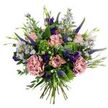 This hand-tied bouquet reads like a small, sunlit English meadow caught in a quiet moment: soft, antique-pink roses sit at the heart, some in tight buds and others unfurling to reveal slightly darker pink edges, their velvety faces offering a gentle, romantic focal point. Two full, dusty-rose carnations bring ruffled, sculptural volume, their layered petals blushing like watercolours against the rose petals. Slender spikes of deep indigo-veronica reach upward, adding vertical punctuation and a cool, dramatic contrast to the pastel tones, while clusters of tiny, pale lavender-blue aster-like blooms, each with a pale yellow centre, scatter an airy, wildflower lightness through the composition. Deeper jewel notes from purple lisianthus buds and small eustoma blooms provide rich accents that catch the eye in lower planes of the bouquet. The piece is softly framed by rounded, silvery-green eucalyptus leaves whose satiny texture cools and calms the palette, and by bright lime-green textural filler-reminiscent of santini or viburnum clusters-that gives a fresh, dewy pop and supports the arrangement's shape. Slender green leaves and emerging buds weave through the stems, lending an organic, just-gathered feeling; the stems are visible at the base, confirming a hand-tied technique held with careful tension. Photographed against a crisp white background and bathed in soft, diffuse light, the bouquet radiates an understated joy: suitable for birthdays, thoughtful thank-yous, or as a serene sympathy tribute, and excellent for brightening a home with a sense of perennial spring. The overall impression is one of considered abundance-textural, fragrant, and unpretentiously elegant-ready to convey comfort, celebration, or quiet affection.