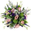 Captured from a bird's-eye view, this hand-tied bouquet fills the frame with a lush blend of pink, purple, and fresh green, resting on a bright white surface that makes the colours glow. At its core, generously open roses in blush, dusty pink, and soft mauve unfurl in layered spirals, each petal smooth and slightly curled at the edges, giving a sense of softness you can almost feel. Scattered between the roses are delicate, daisy-like aster blooms in pale lavender, their fine petals circling tiny yellow centres that add light and playfulness to the composition. Rich, velvety lisianthus flowers in deep indigo and royal purple tuck into the spaces, their ruffled, bell-shaped petals adding depth and a sophisticated, evening-like mood. Slender spikes of vivid purple Veronica rise and weave through the arrangement, introducing slender, vertical lines that gently break the rounded shape and evoke a breeze through a summer garden. Small, spherical tufts of bright green, reminiscent of Dianthus Green Trick, offer a quirky, mossy texture that contrasts beautifully with the smooth petals and gives the bouquet a contemporary twist. Soft eucalyptus in cool, silvery-green tones winds through and around the flowers, its rounded leaves providing a tranquil backdrop and suggesting a fresh, herbal scent. Extra foliage and closed buds are tucked in to create a dense, rounded, and luxurious shape, as if composed for a stylish table in a Golders Green flat near the station. The bouquet radiates joy, romance, and quiet celebration, perfectly suited for thoughtful same-day flower delivery to homes and offices across NW11.